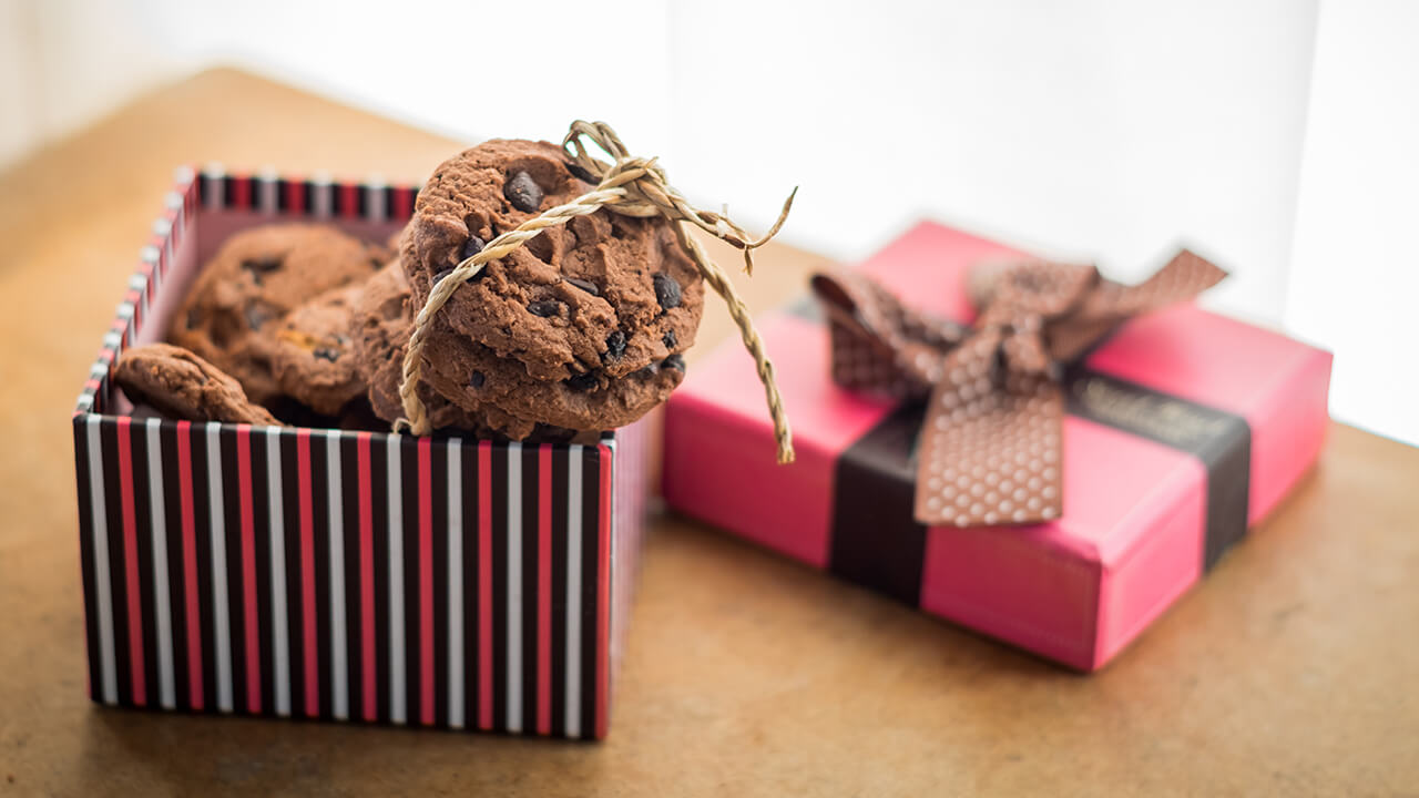 A gift box filled with chocolate chip cookies